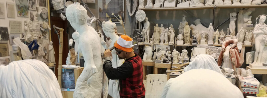 carrara creative city, marble sculptor at work