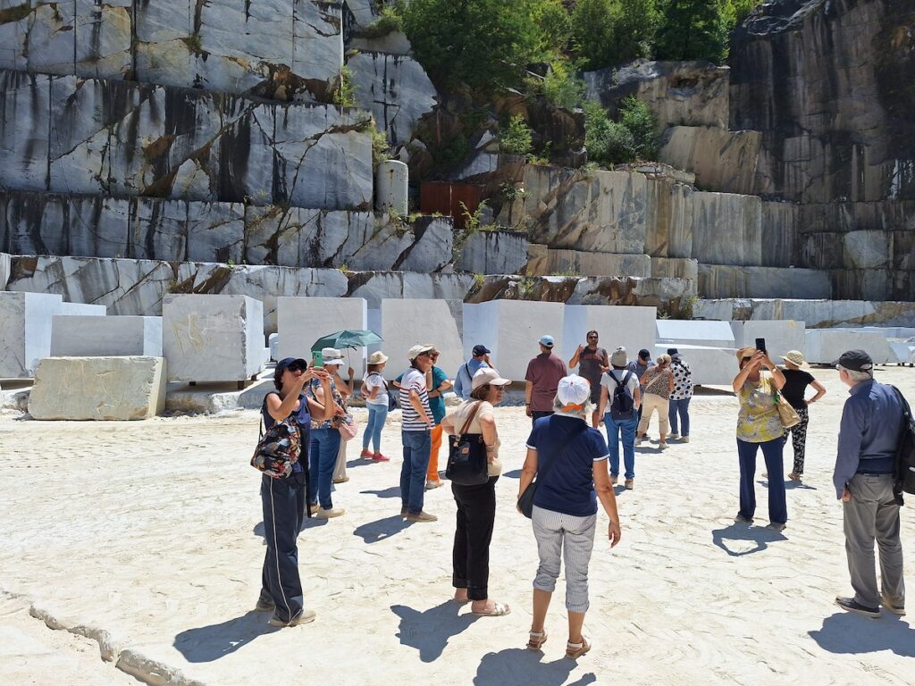 colonnata valley and workshops, group visiting the inside of a marble quarry 