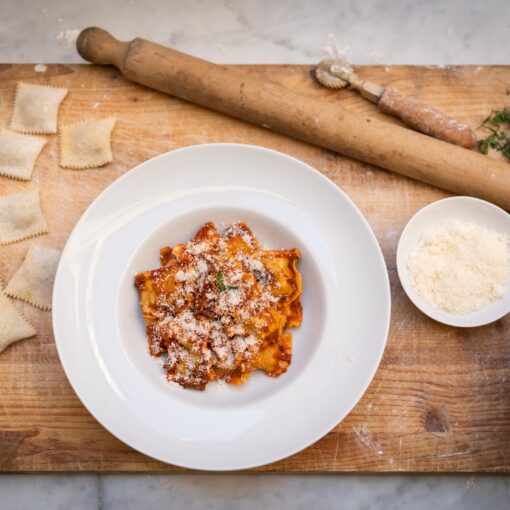stuffed ravioli with tomato sauce, carrara's typical food
